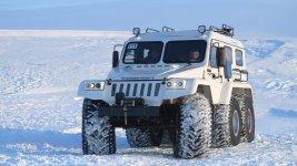 russias-president-vladimir-putin-seen-in-an-allterrain-vehicle-at-picture-id660231282.jpeg